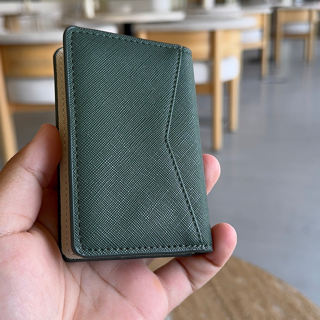 A dark green textured leather card holder wallet 